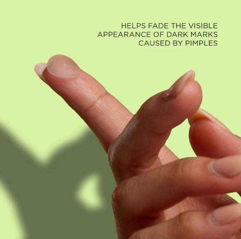 Transparent acne patch on finger