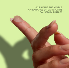 Transparent acne patch on finger